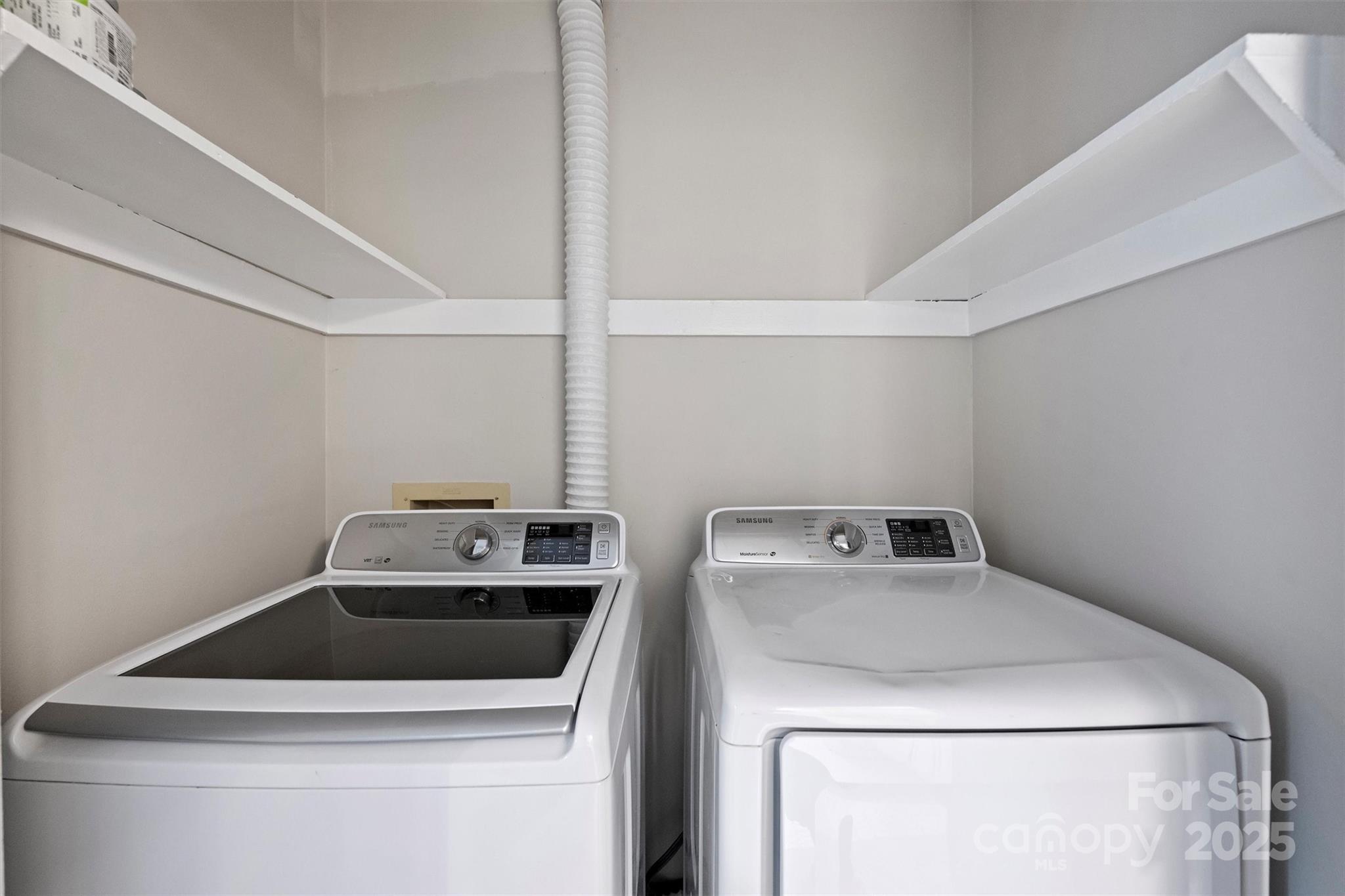 430 Queens Road, Unit 712 Charlotte, NC 28204 - Photo 36 of 43 a utility room with dryer and washer