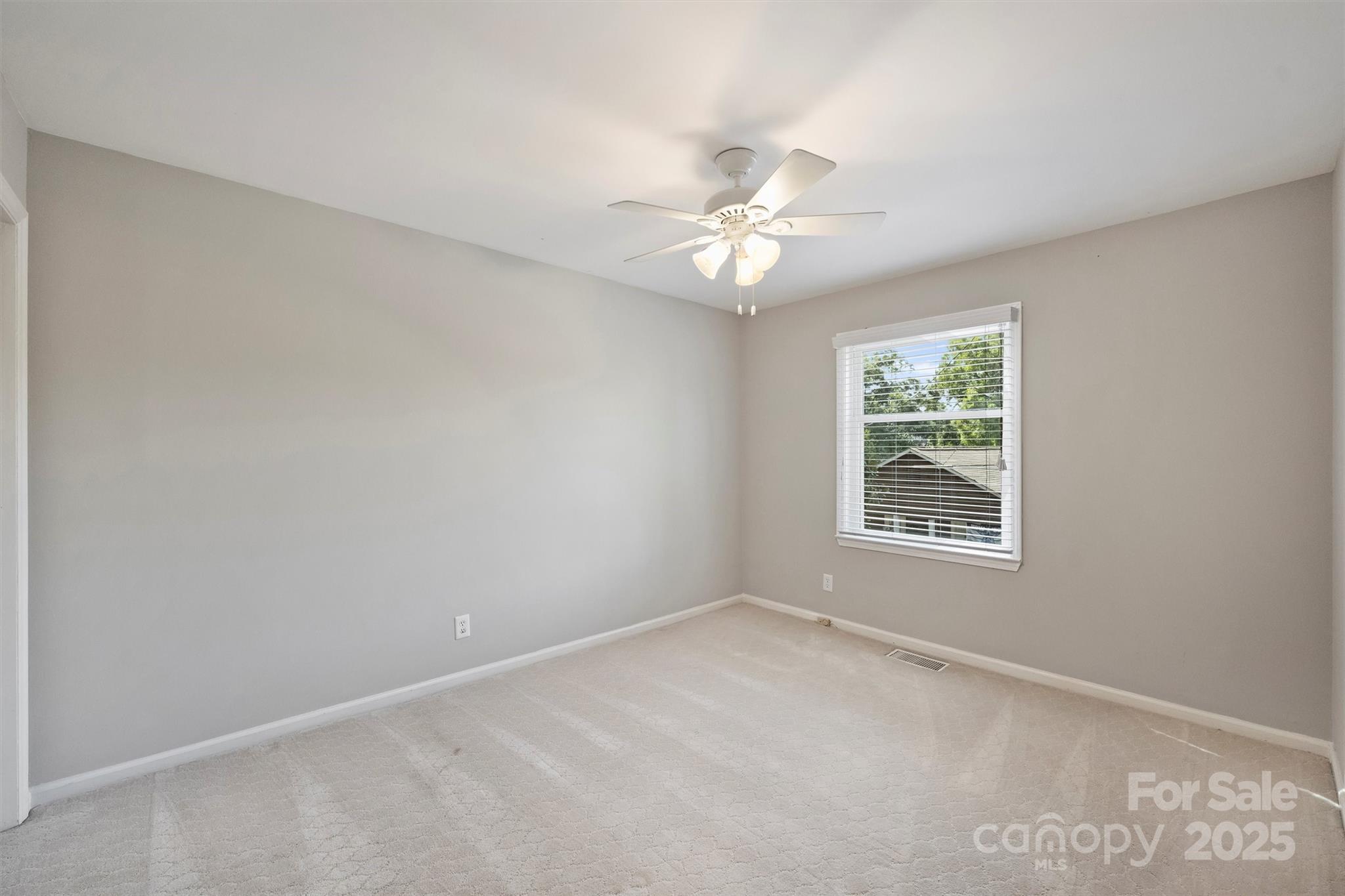 430 Queens Road, Unit 712 Charlotte, NC 28204 - Photo 38 of 43 an empty room with a window