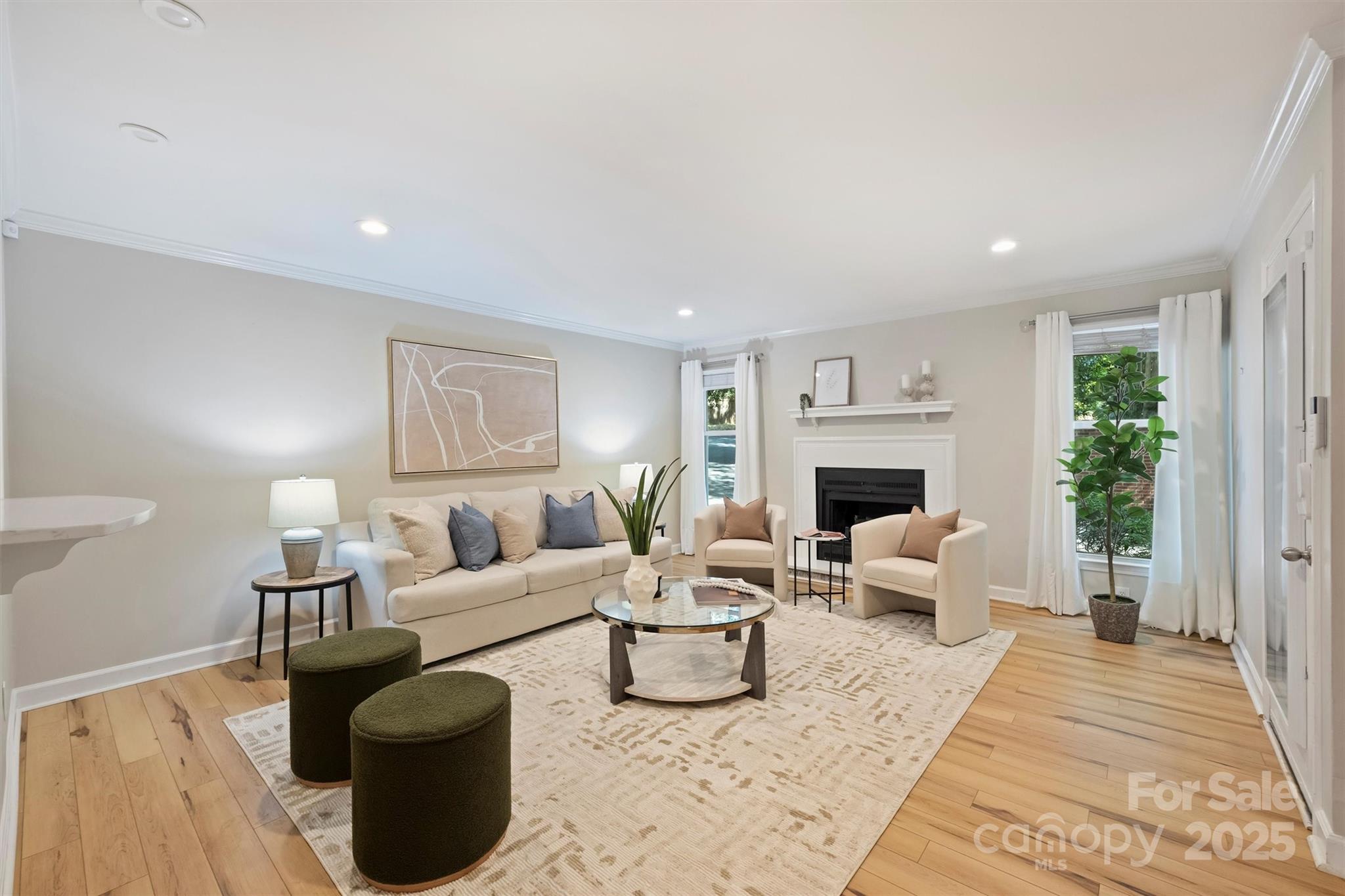 430 Queens Road, Unit 712 Charlotte, NC 28204 - Photo 4 of 43 a living room with furniture and a fireplace