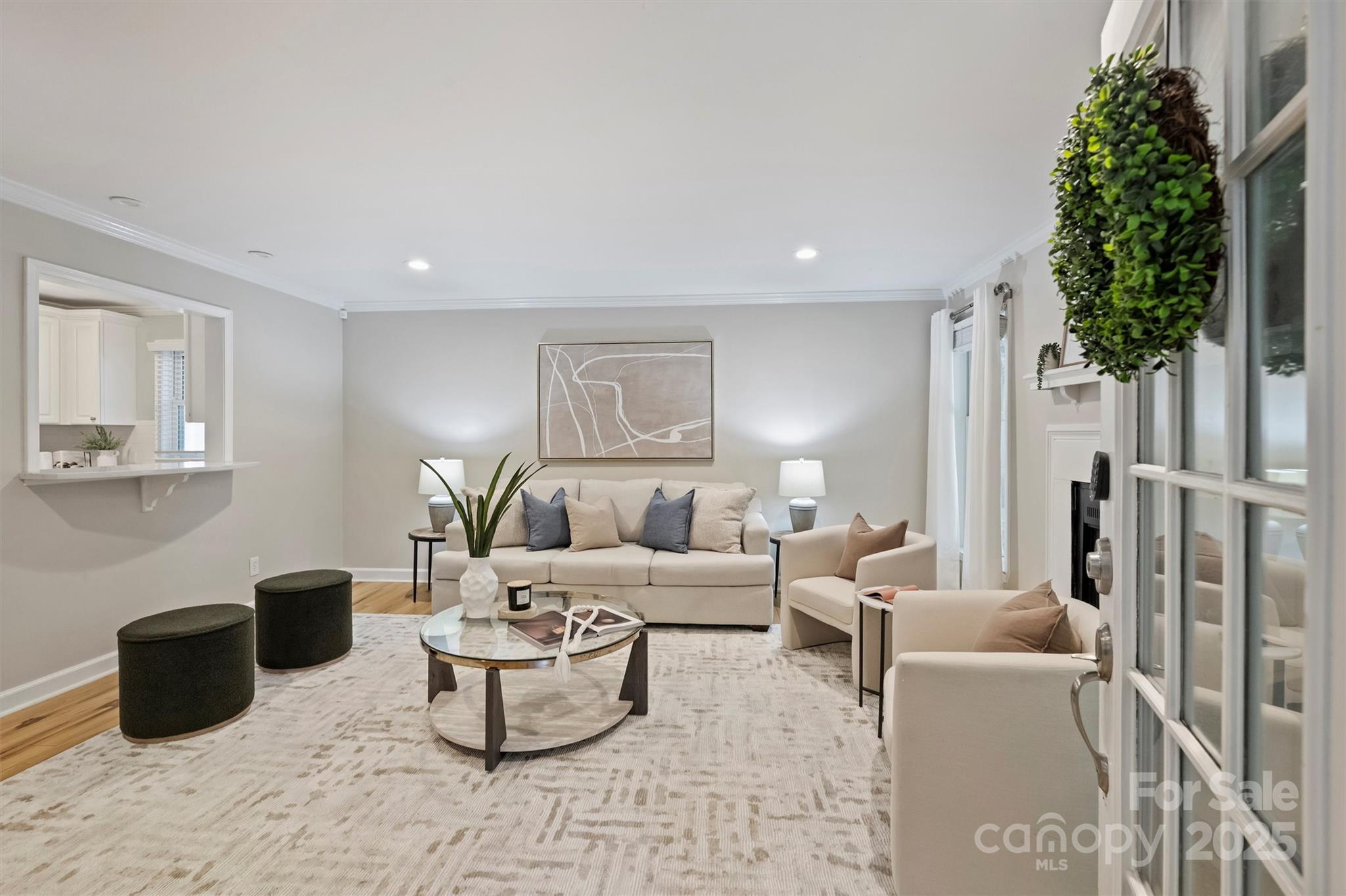 430 Queens Road, Unit 712 Charlotte, NC 28204 - Photo 5 of 43 a living room with furniture potted plant and a window