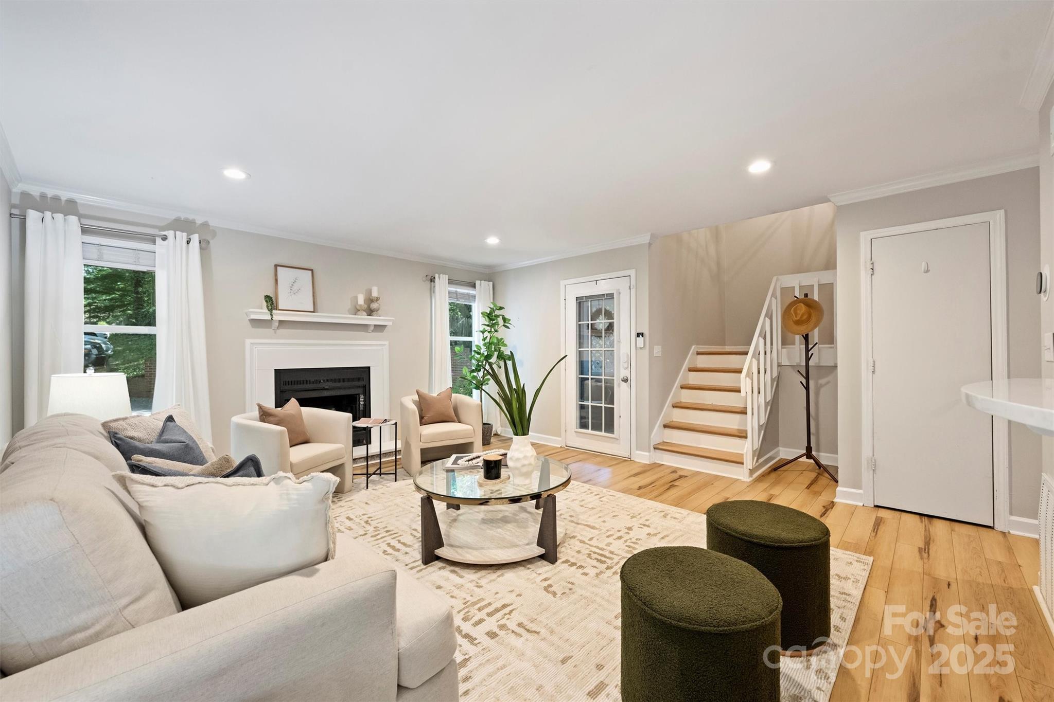 430 Queens Road, Unit 712 Charlotte, NC 28204 - Photo 7 of 43 a living room with furniture and a fireplace