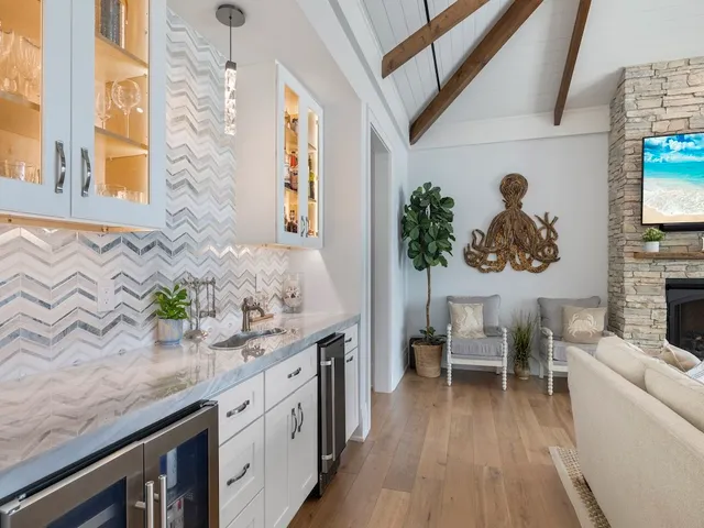 a spacious bathroom with a granite countertop sink and a mirror