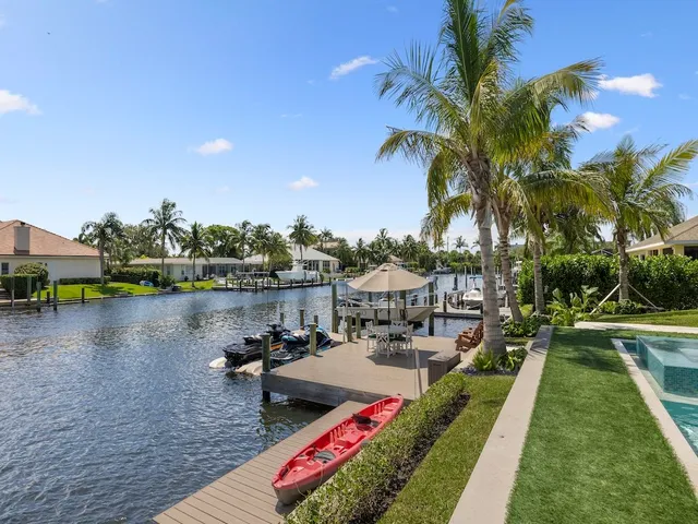 a view of swimming pool with outdoor seating and lake view