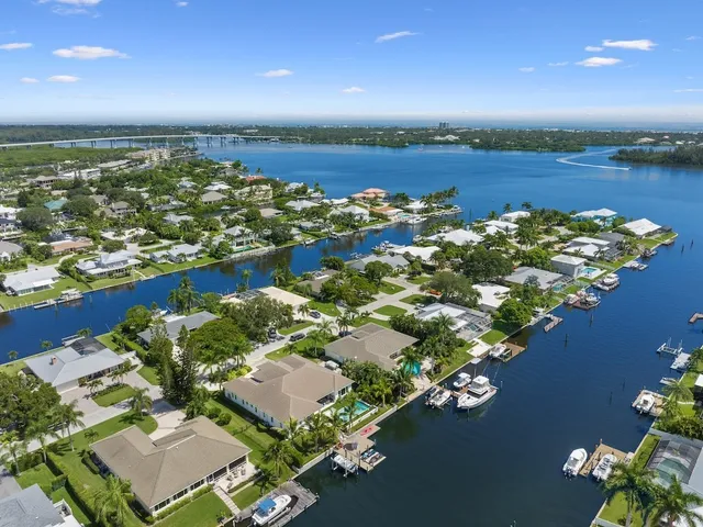 an aerial view of a house with a lake view