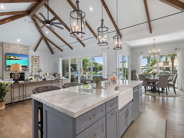 a kitchen with sink cabinets and wooden floor