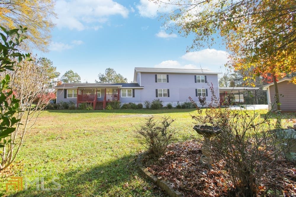 279 Whitworth Road Villa Rica, GA 30180 - Photo 1 of 1 a view of a house with a yard