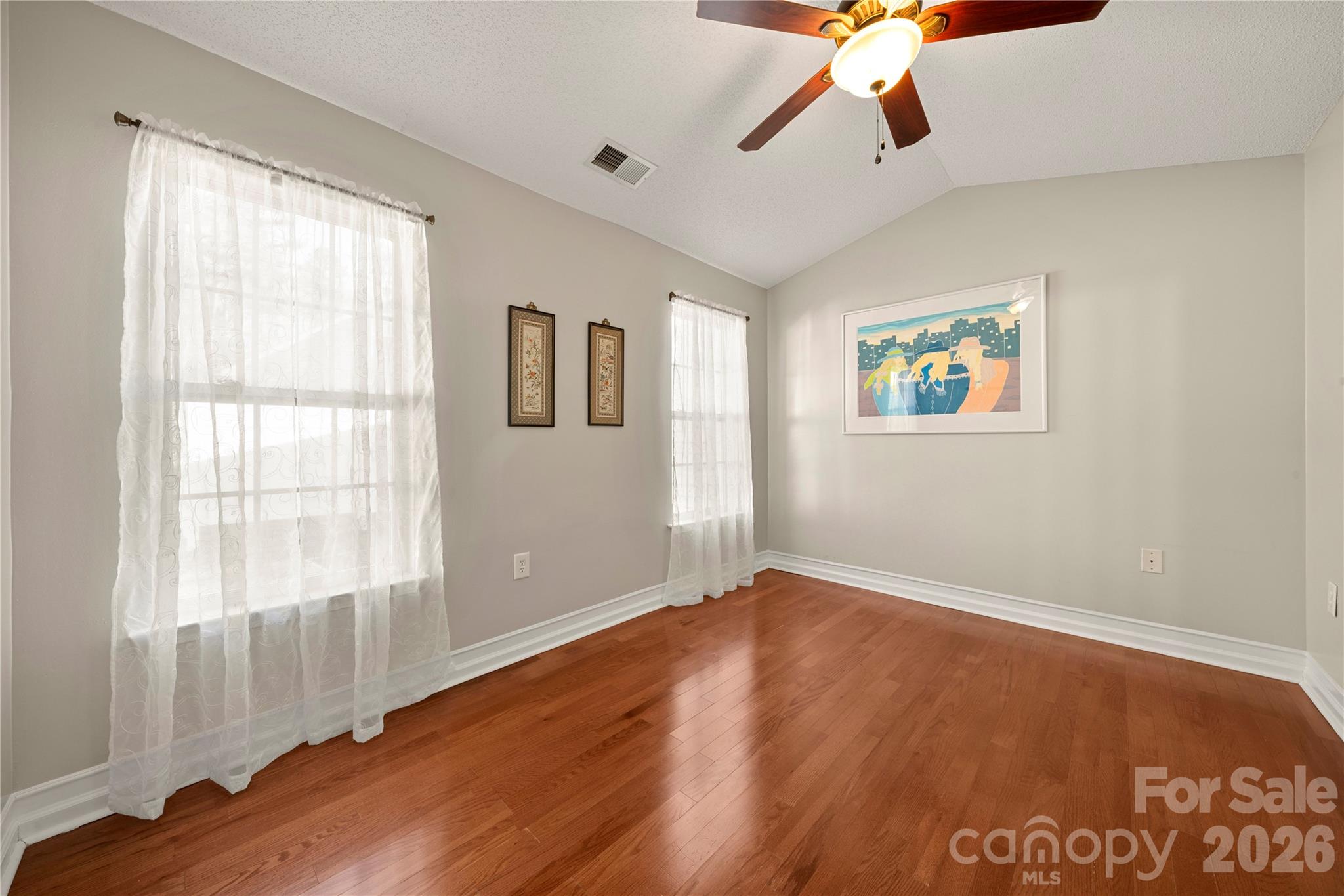 461 Lexie Lane Rock Hill, SC 29732 - Photo 8 of 20 a view of an empty room with a window and wooden floor