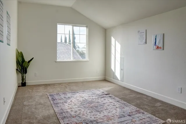 a view of an empty room and window