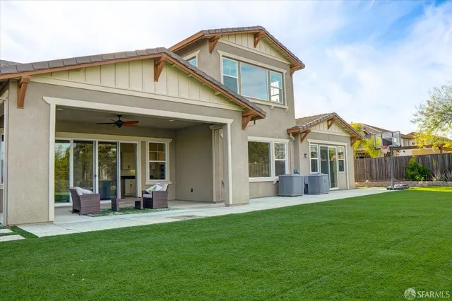 a front view of a house with a garden and porch