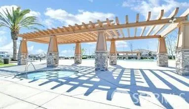a view of a patio with a table and chairs