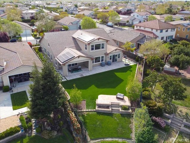 an aerial view of a house with a garden