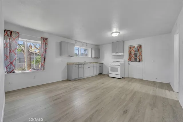 a view of a kitchen with microwave and cabinets