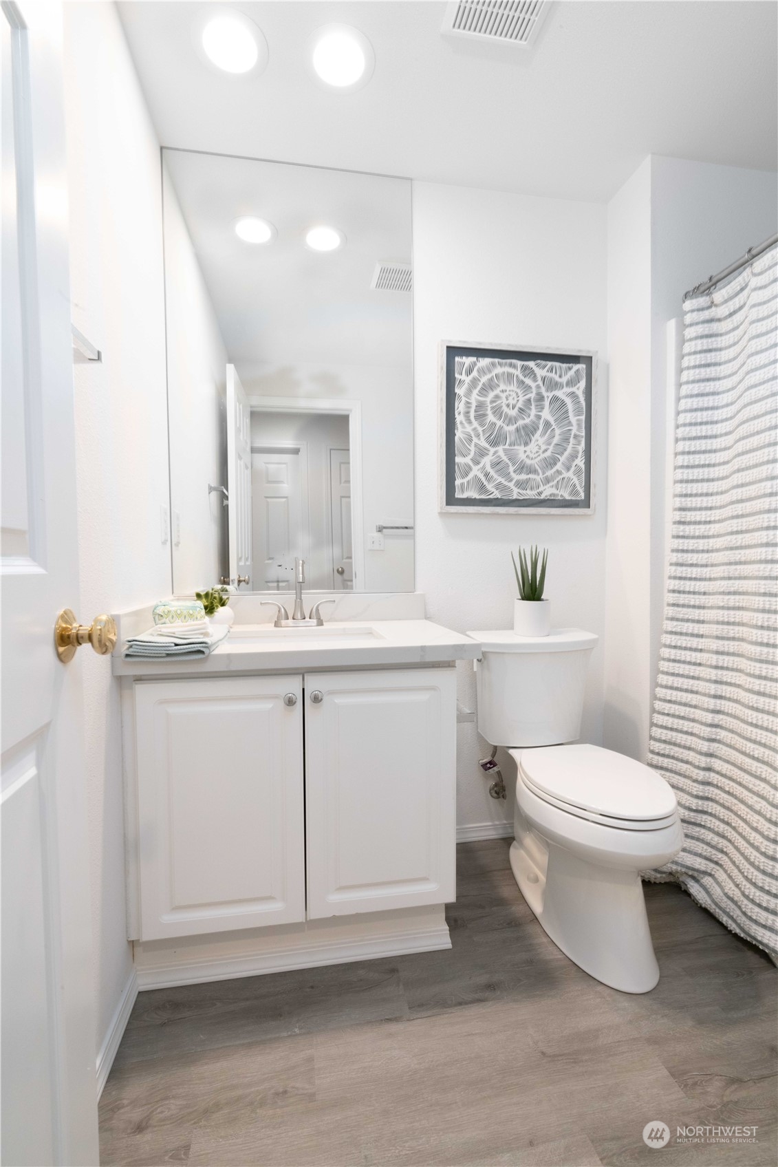 3725 Northeast 6th Street Renton, WA 98056 - Photo 15 of 19 a bathroom with a toilet sink and mirror