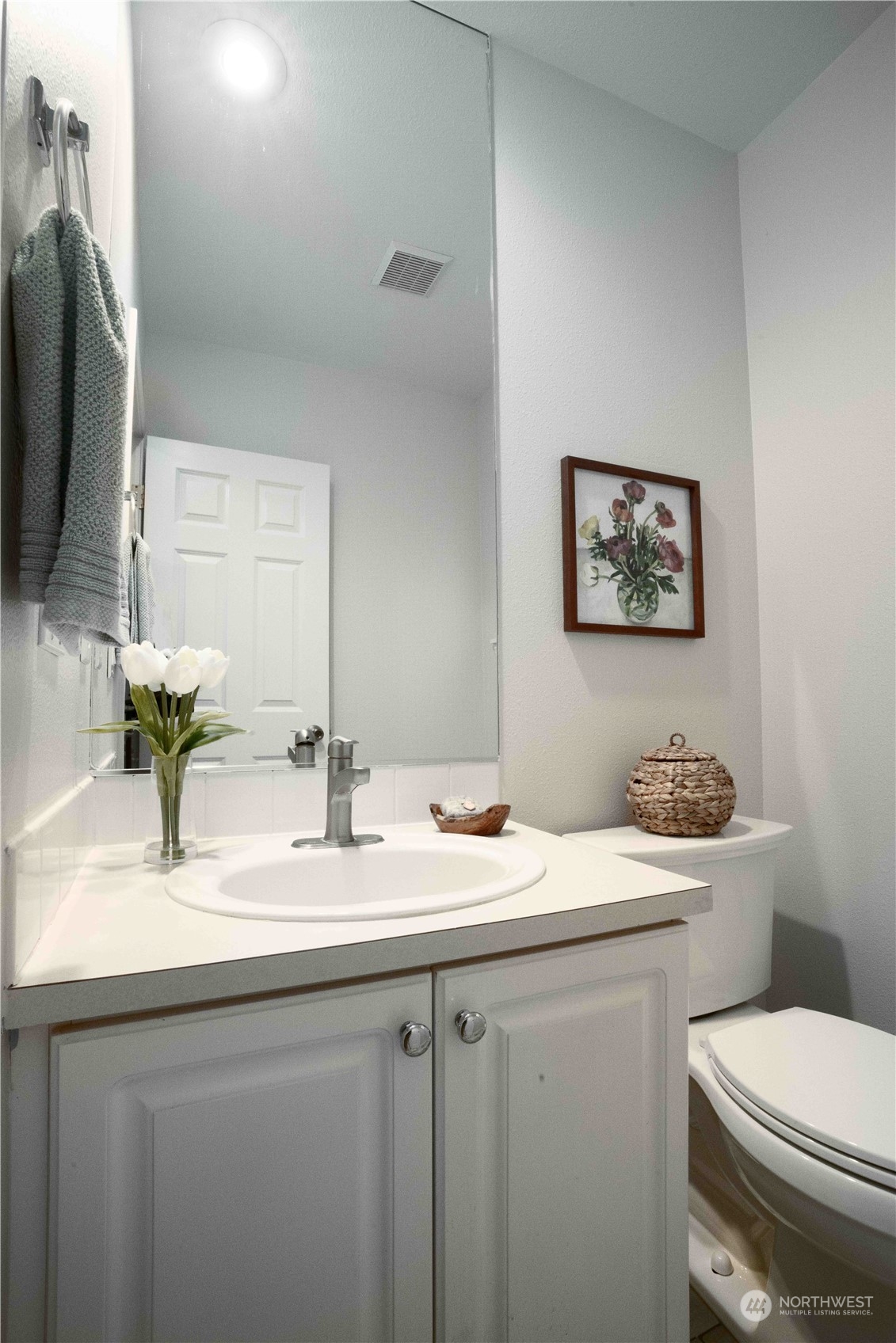 3725 Northeast 6th Street Renton, WA 98056 - Photo 17 of 19 a bathroom with a granite countertop toilet sink and mirror