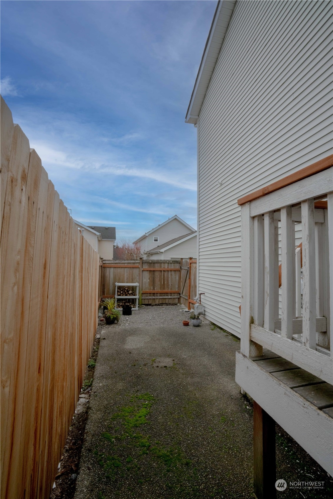 3725 Northeast 6th Street Renton, WA 98056 - Photo 19 of 19 a view of a house with backyard space and wooden fence