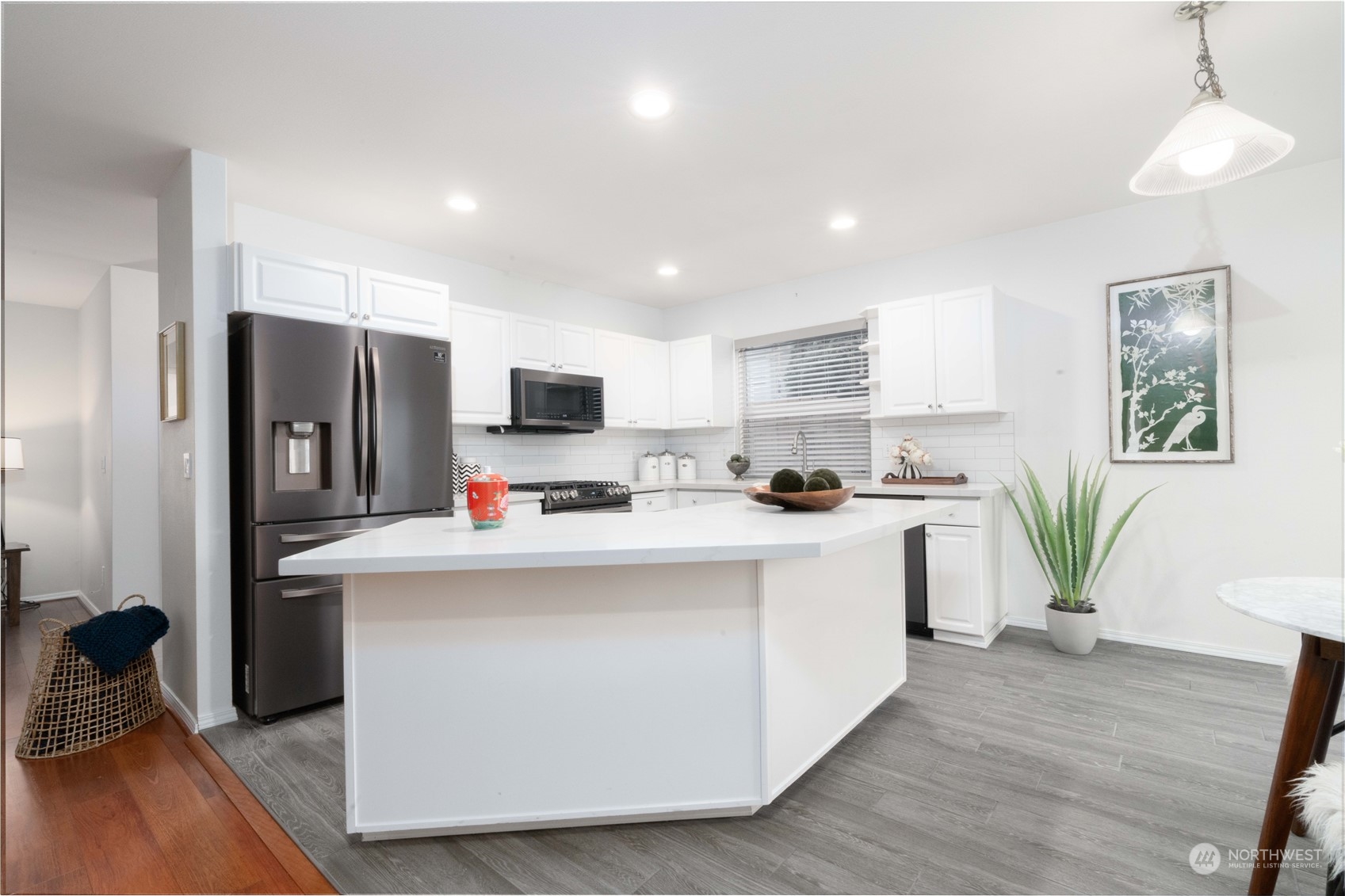 3725 Northeast 6th Street Renton, WA 98056 - Photo 5 of 19 a kitchen with kitchen island white cabinets and refrigerator