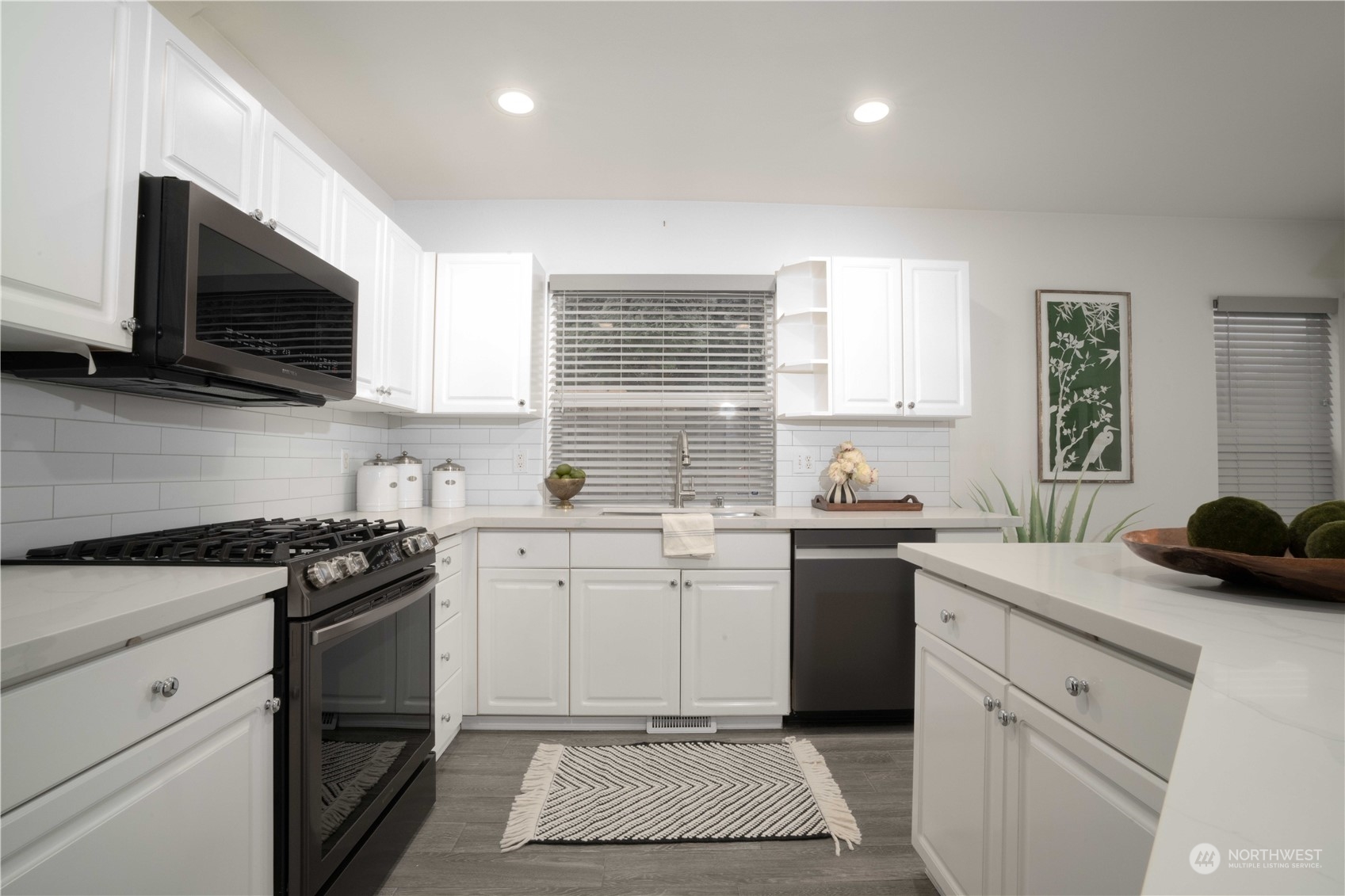 3725 Northeast 6th Street Renton, WA 98056 - Photo 7 of 19 a kitchen with a sink stove and microwave