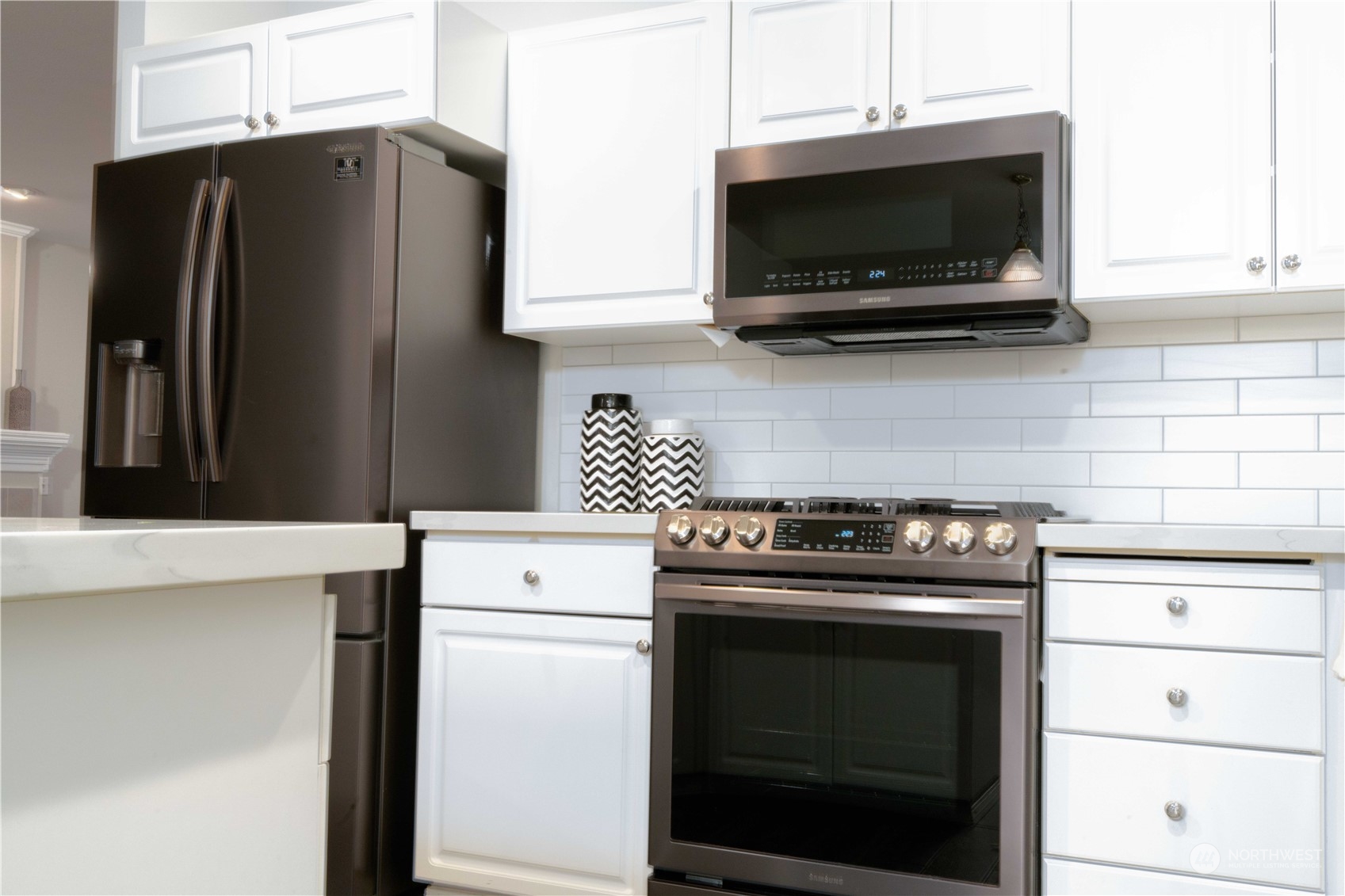 3725 Northeast 6th Street Renton, WA 98056 - Photo 8 of 19 a kitchen with a stove and a microwave
