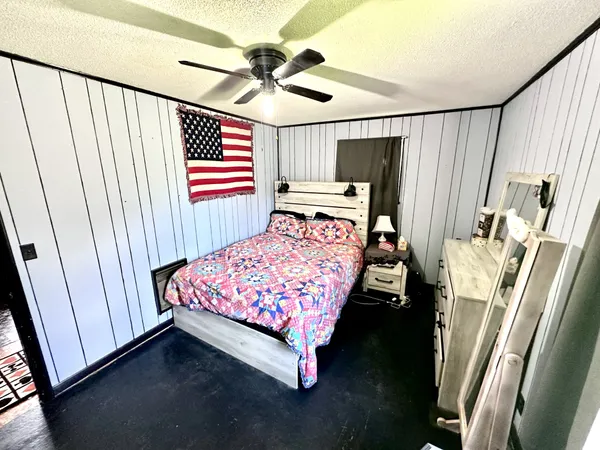 a bed sitting in a room next to a window