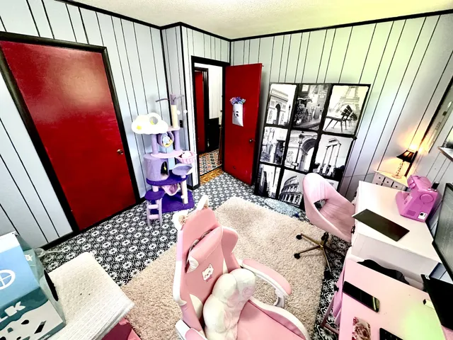 a bedroom with furniture and a window