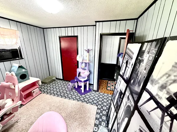 a bedroom with furniture and a window