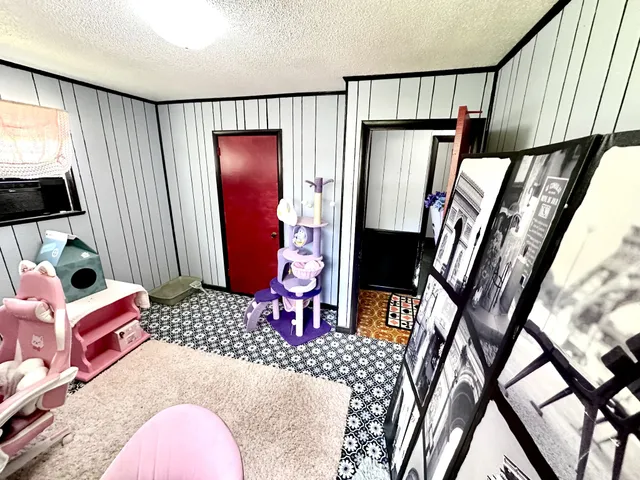 a bedroom with furniture and a window