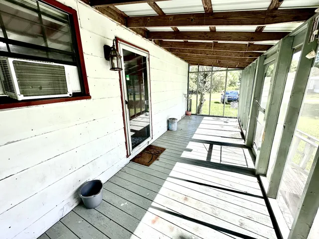 a view of balcony with wooden floor