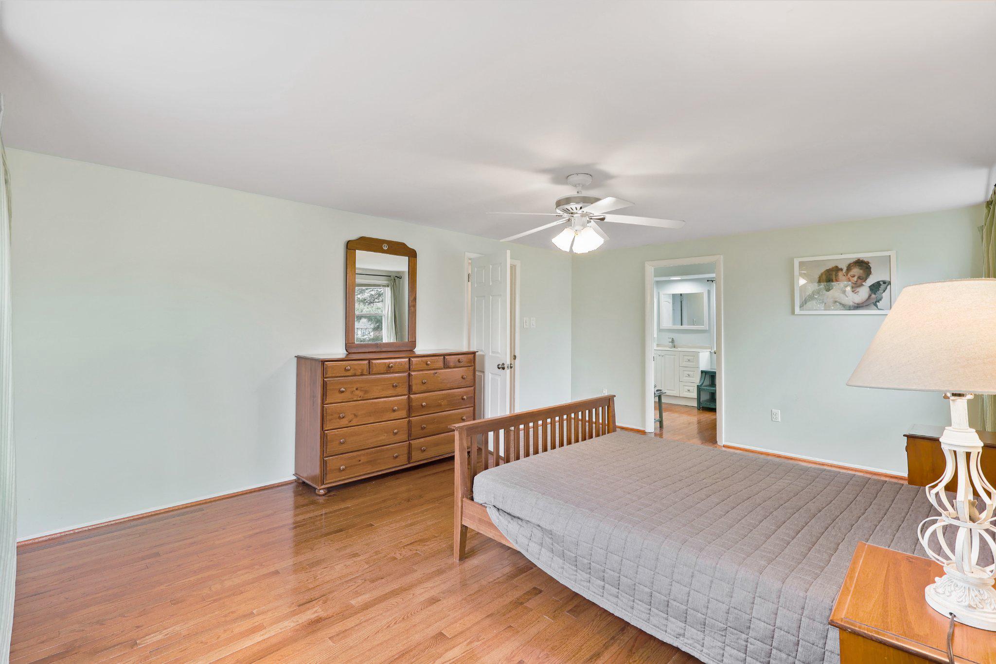 4228 Pageant Lane Fairfax, VA 22033 - Photo 18 of 33 a bedroom with a bed and wooden floor