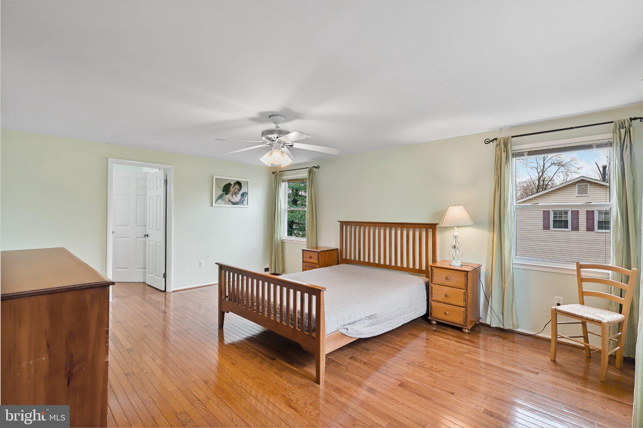 4228 Pageant Lane Fairfax, VA 22033 - Photo 19 of 33 a bedroom with a bed and wooden floor
