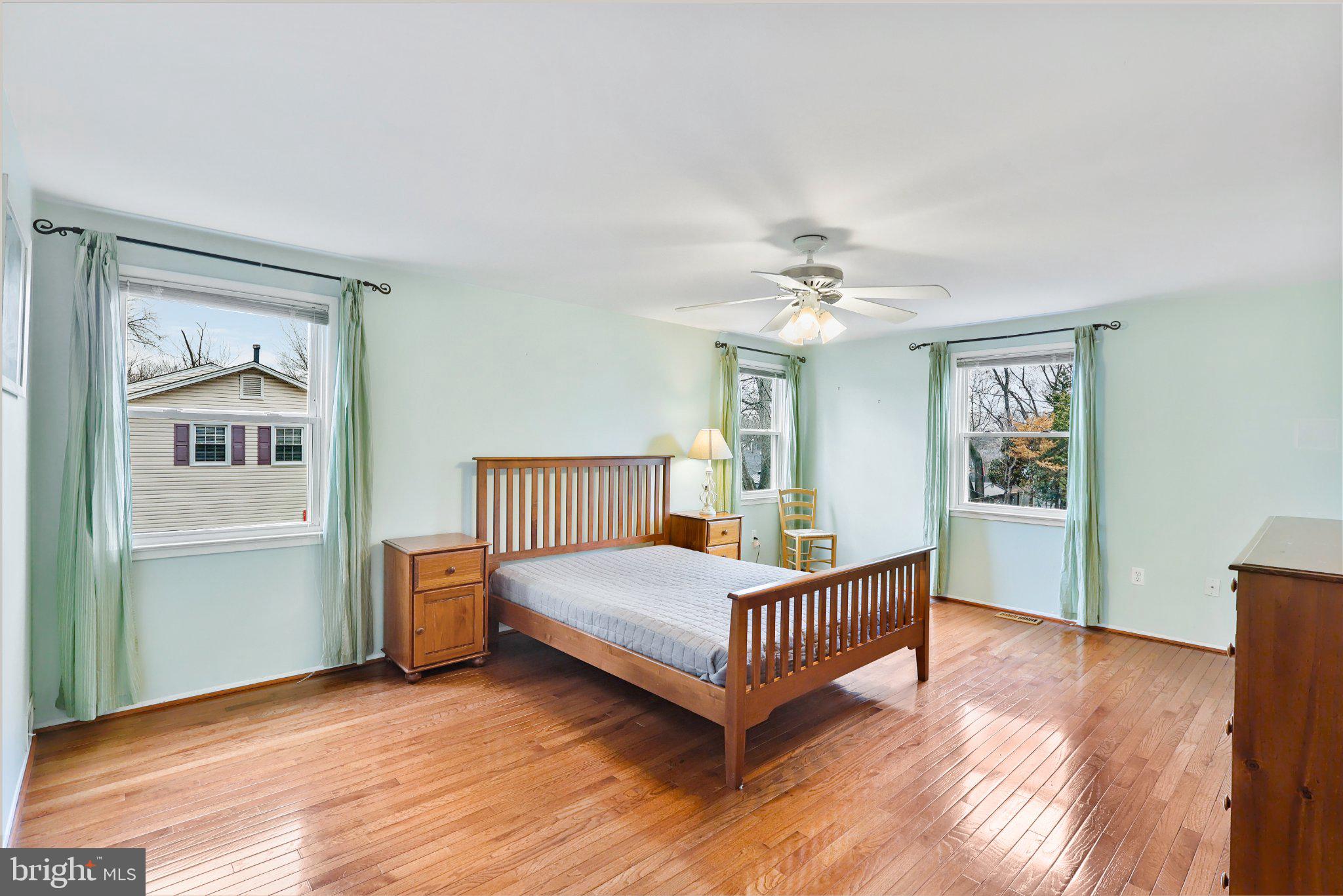 4228 Pageant Lane Fairfax, VA 22033 - Photo 26 of 33 a bedroom with a bed and a chandelier
