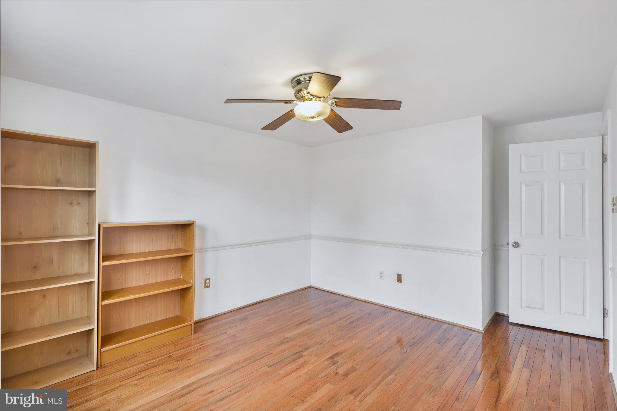 4228 Pageant Lane Fairfax, VA 22033 - Photo 27 of 33 a view of a room with wooden floor and chandelier fan