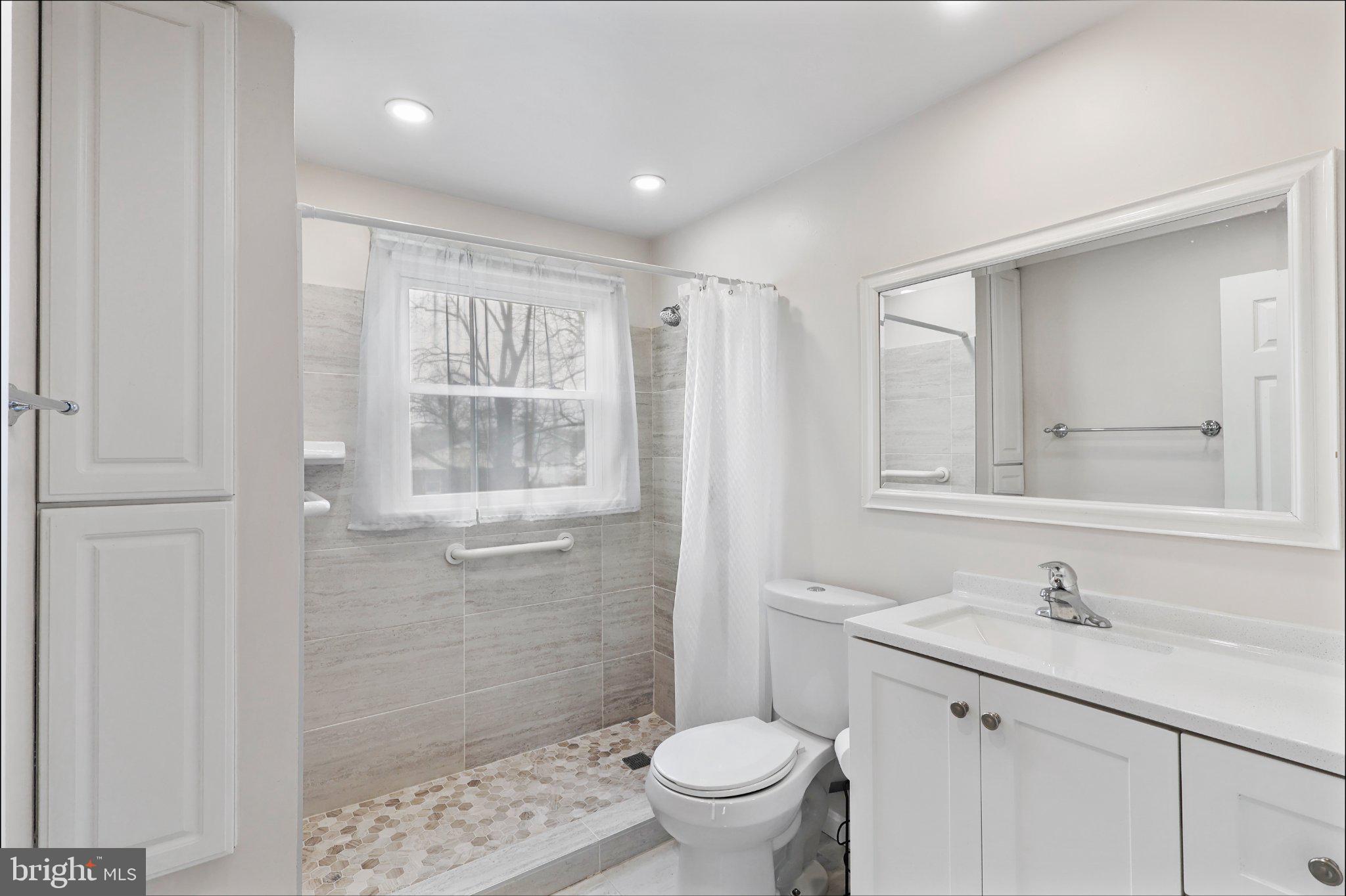 4228 Pageant Lane Fairfax, VA 22033 - Photo 30 of 33 a bathroom with a sink toilet and shower