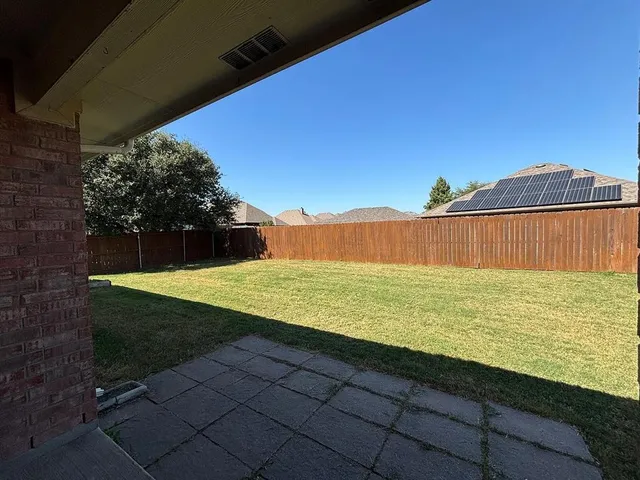 a view of a yard with an outdoor space