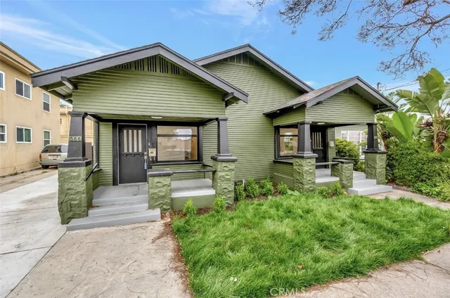 a front view of a house with garden