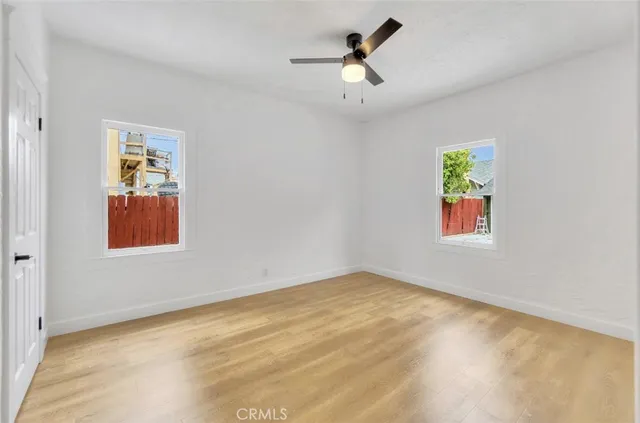 a view of room with window and ceiling fan
