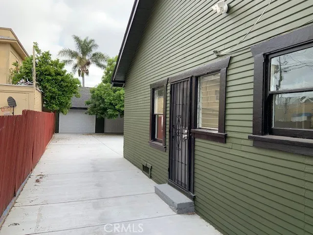 a view of a porch with wooden stairs