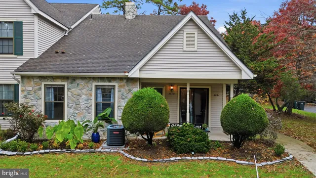 a view of a house with a yard and plants