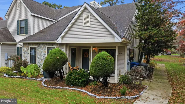 a view of a house with garden and plants
