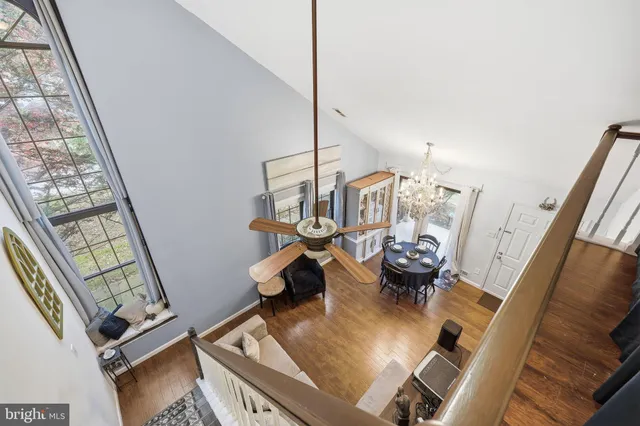 a view of living room with furniture and floor to ceiling window