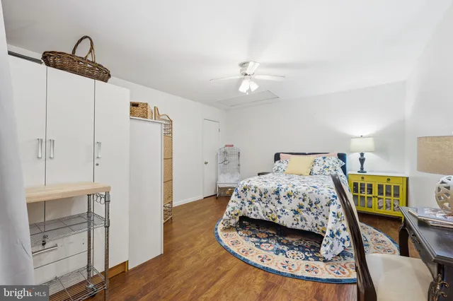 a bedroom with a bed and a table in it