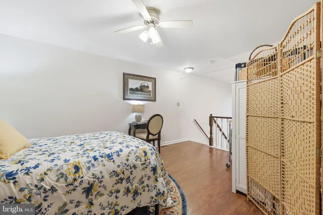 a bedroom with a bed and a table with chair