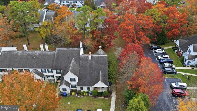 an aerial view of houses with yard