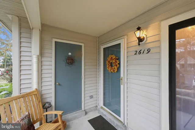 a view of hallway with a front door and windows