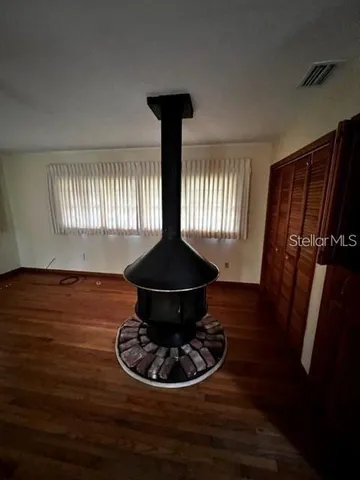 a vase of flowers sitting on a dining table