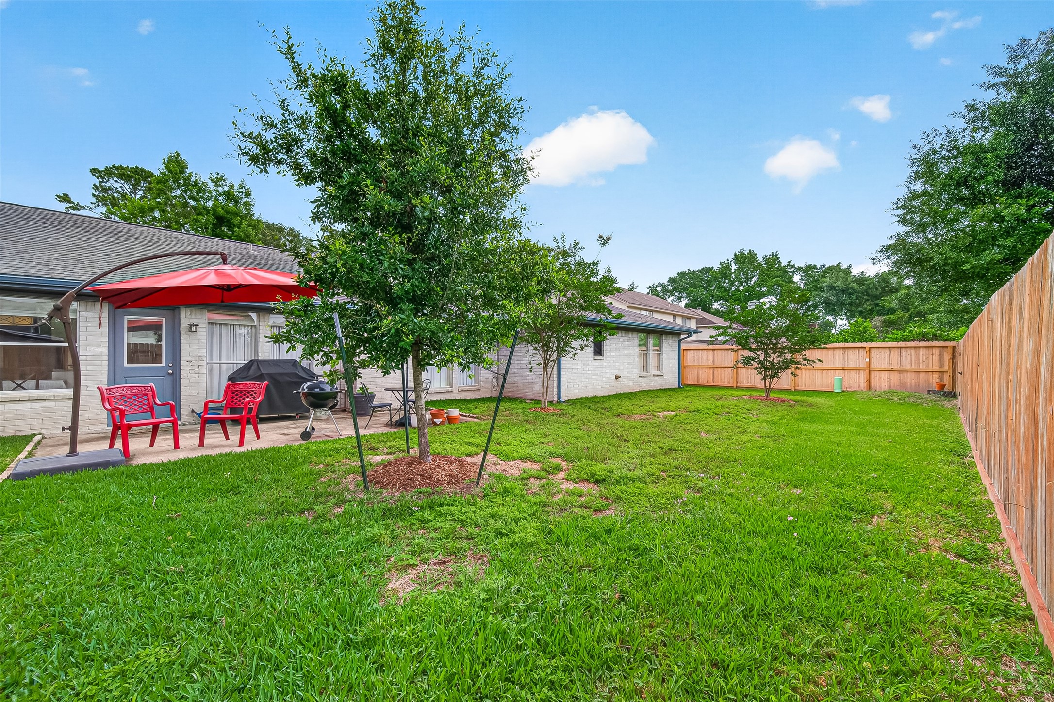 17611 Sorrell Ridge Drive Spring, TX 77388 - Photo 47 of 50 a view of a table and chairs under the tree