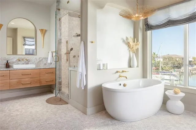 a bathroom with a bathtub and sink