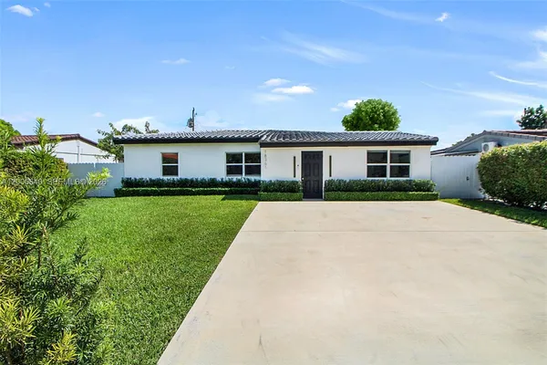 front view of a house with a yard
