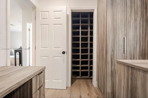 a view of walk in closet and empty room