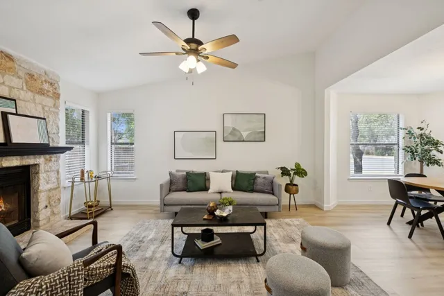 a living room with furniture and a fireplace