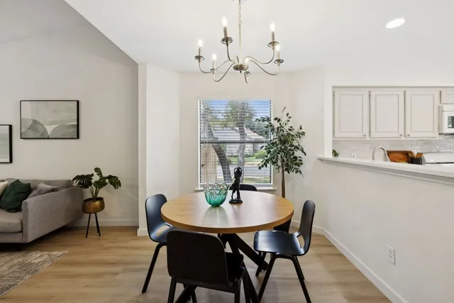 a view of a dining room with furniture and wooden floor